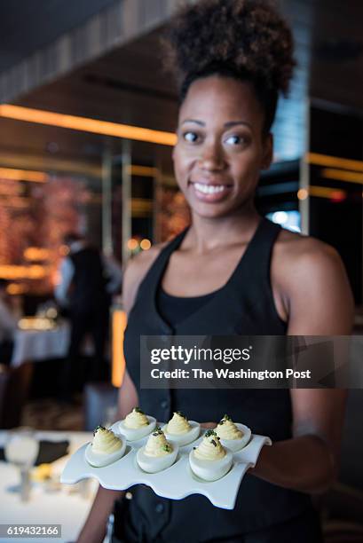Lindsay Gray serving White Truffle Caviar Deviled Eggs at Ocean Prime.
