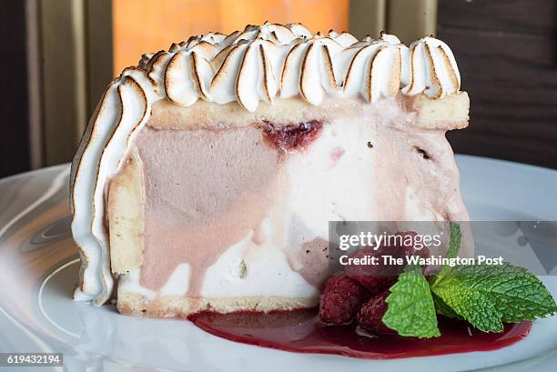 Baked Alaska - Pound Cake with Vanilla, Chocolate and Strawberry Ice Cream, Toasted Meringue & Fresh Raspberries at Ocean Prime.