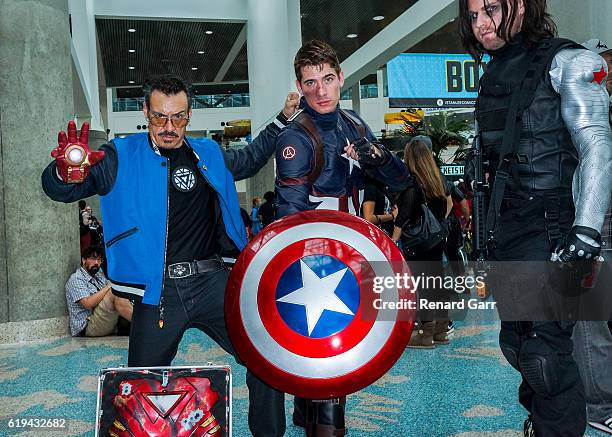 Center: Shelby Avila as Captain America with Cosplayer Tony Stark and Bucky at Los Angeles Convention Center on October 30, 2016 in Los Angeles,...