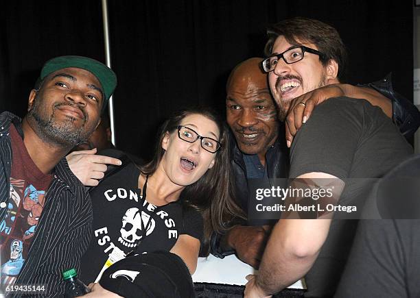 Boxer Mike Tyson poses with fans at day 3 of Stan Lee's Los Angeles Comic Con 2016 held at Los Angeles Convention Center on October 30, 2016 in Los...