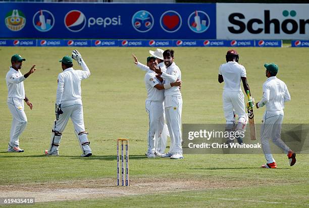 Mohammad Amir of Pakistan takes the wicket of Jermaine Blackwood of West Indies on day two of the third test between Pakistan and West Indies at...