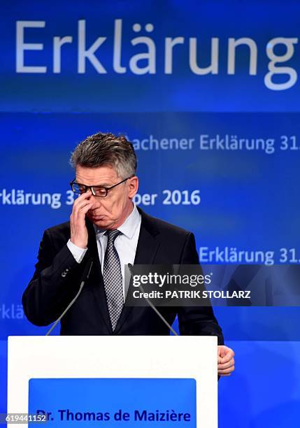 German Interior Minister Thomas de Maiziere attends a press conference after a meeting between Interior Ministers from Belgium, the Netherlands and...