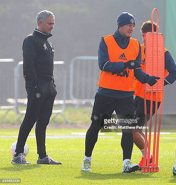 Manager Jose Mourinho and Bastian Schweinsteiger of Manchester United in action during a first team training session at Aon Training Complex on...