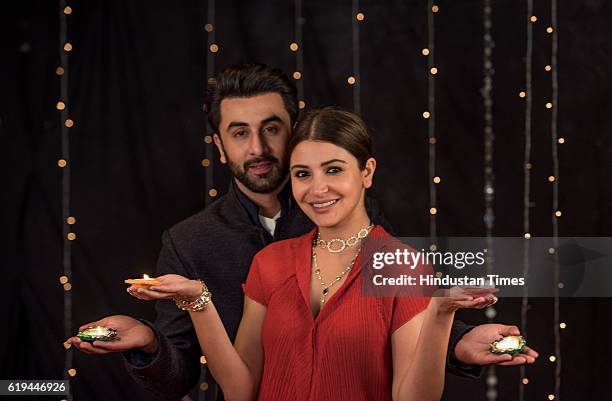 Bollywood actress Anushka Sharma and actor Ranbir Kapoor pose for the Diwali photo shoot on October 25, 2016 in Mumbai, India.