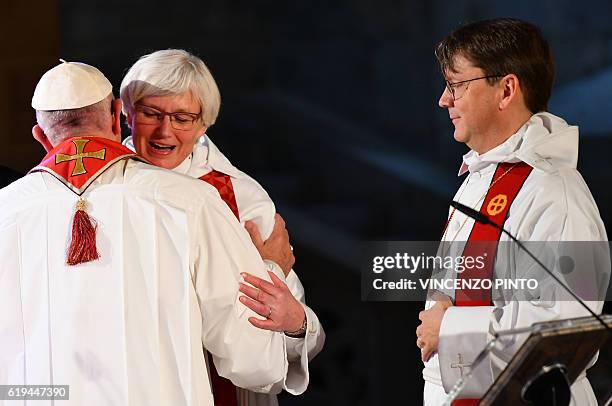 Pope Francis greets Swedish bishop Antje Jackelen during an ecumenical prayer at the Lund Cathedral on October 31, 2016 in Lund, Sweden. Francis...
