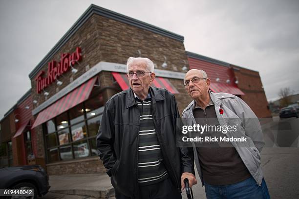 Bob Beattie and Joe Piovesan, outside the Tim Horton's they visit a few times a week. Visiting Woodstock, Ontario, to find the mood of folks in light...