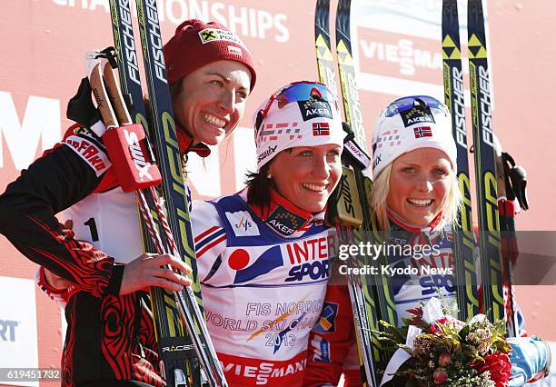 Italy - Marit Bjoergen of Norway poses on the podium after winning the 30-kilometer classical event of the Nordic skiing world championships in Val...