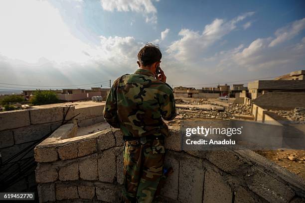 Peshmerga soldier inspects a house, has been used and left by Daesh terrorist after Iraqi Kurdish Regional Government's peshmerga forces recapture...