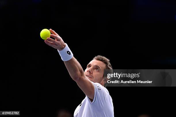 Paul-Henri Mathieu of France serves during his Men's first round match against Marcos Baghdatis of Cyprus on day one of the BNP Paribas Masters at...