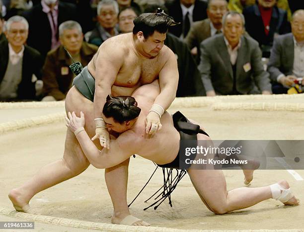 Japan - Top-ranked maegashira Takayasu beats Mongolian grand champion Harumafuji with a thrust down on the third day of the Spring Grand Sumo...