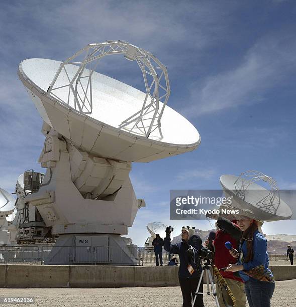 Chile - Reporters are shown the parabolic antennas of the Alma radio telescope on an Andean plateau in northern Chile on March 12 ahead of the...
