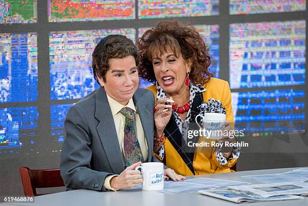 Kathie Lee Gifford dressed as her former co-host Regis Philbin, and Hoda Kotb, dressed as Kathie Lee Gifford from the morning talk show, "Live! With...