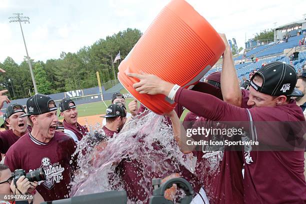 Texas A&M coach Rob Childress gets dunked in Gatorade following an Aggie victory in the Texas A&M versus Florida Final Round game of the SEC Baseball...