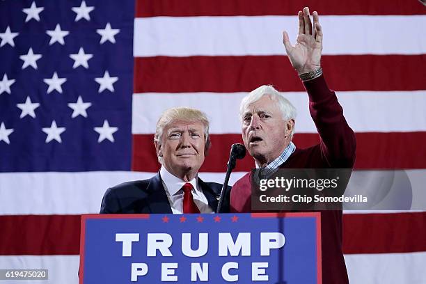 Republican presidential nominee Donald Trump is introduced by former Indiana University basketball coach Bobby Knight during a campaign rally at the...