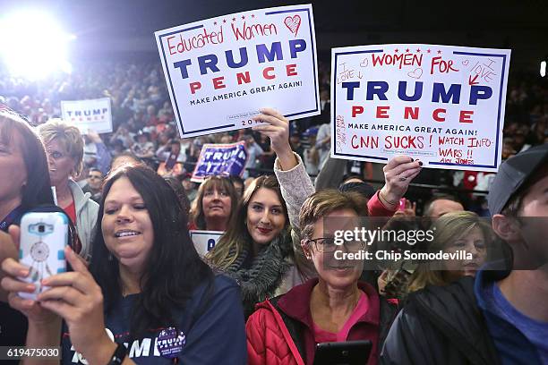 Supporters wait for the arrival of Republican presidential nominee Donald Trump during a campaign rally at the Deltaplex Arena October 31, 2016 in...