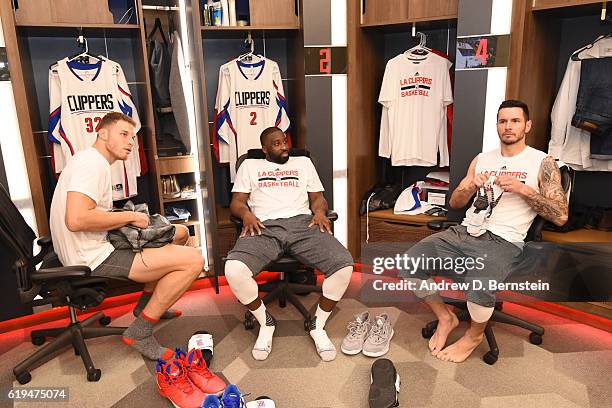 Blake Griffin, Raymond Felton and JJ Redick of the LA Clippers sit in the locker room and get ready before the game against the Utah Jazz on October...