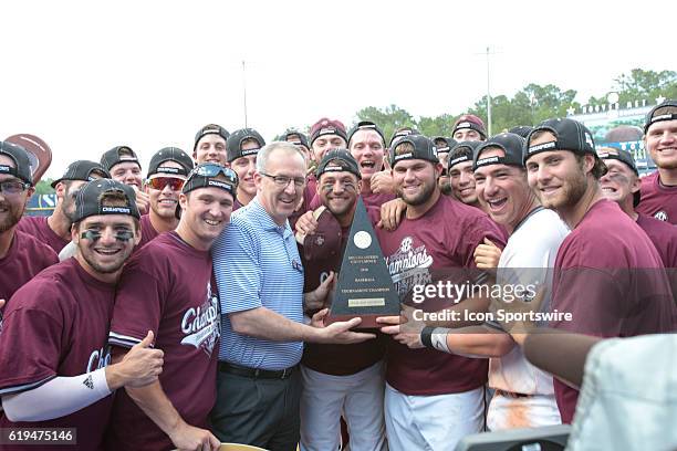 Texas A&M players accept the tournament champion trophy from SEC Commissioner, Greg Sankey during the Texas A&M versus Florida Final Round game of...