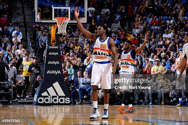 Kenneth Faried and Emmanuel Mudiay of the Denver Nuggets celebrate during a game against the Portland Trail Blazers on October 29, 2016 at the Pepsi...