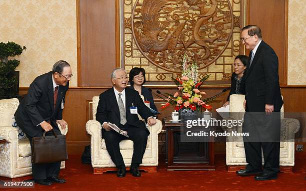 China - Former Chinese State Councilor Tang Jiaxuan, who leads the China-Japan Friendship Association, Hiromasa Yonekura, who chairs the Japan...