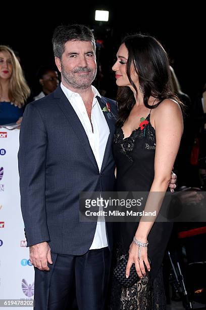 Simon Cowell and Lauren Silverman attend the Pride Of Britain Awards at The Grosvenor House Hotel on October 31, 2016 in London, England.