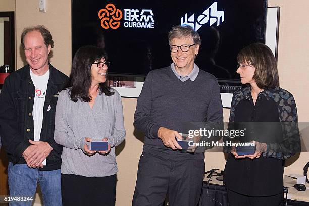 Bridge Players Fred Gitelman, Sheri Winestock, Bill Gates and Sharon Osberg pose for a photo before playing the first live Yeh Online Bridge World...