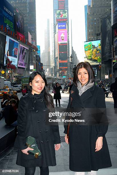 United States - Rie Yano and Jie Zheng, business partners who jointly launched the ''Material Wrld'' fashion website, pose on a Manhattan street in...