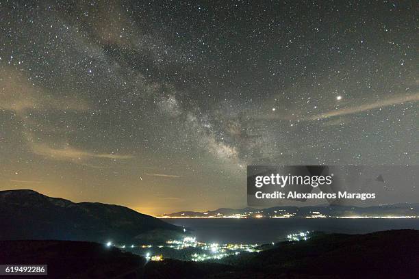 the milky way over peloponnese, greece - pluto dwarf planet stockfoto's en -beelden