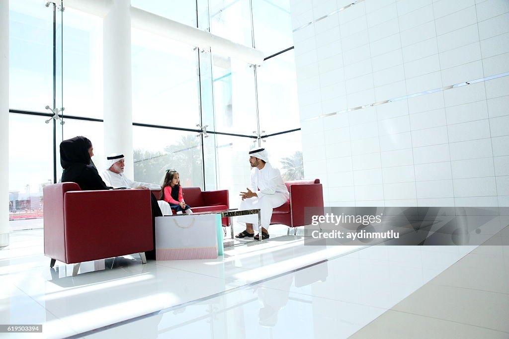Middle Eastern family in shopping mall