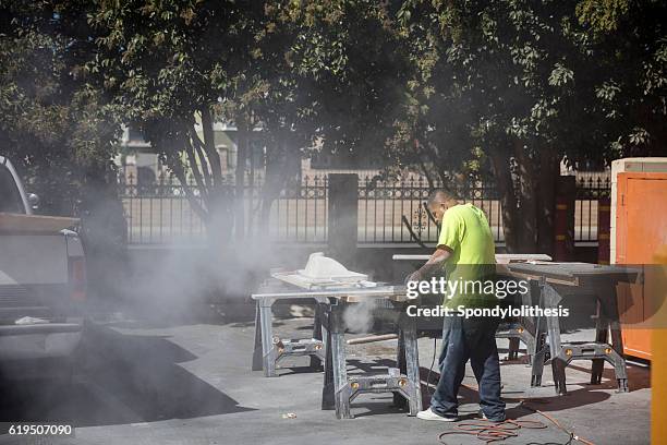 mexican worker cutting granite without any protection - respiratory protection construction stock pictures, royalty-free photos & images