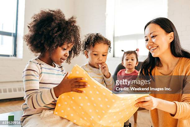 family time - asian teacher stock pictures, royalty-free photos & images