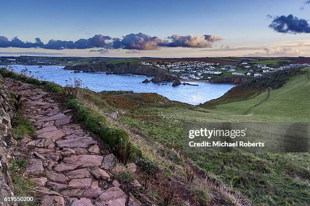 the seaside village of hope cove seen at dawn from bolt tail, devon - devon stockfoto's en -beelden