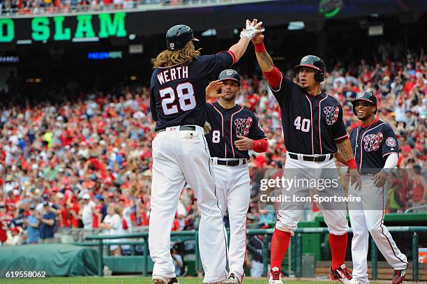 Washington Nationals pinch hitter Jayson Werth is congratulated at home plate by shortstop Danny Espinosa , catcher Wilson Ramos and center fielder...