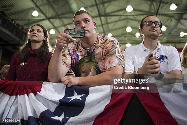 Attendees listen to Hillary Clinton, 2016 Democratic presidential nominee, not pictured, speak during a campaign event in Cleveland, Ohio, U.S., on...