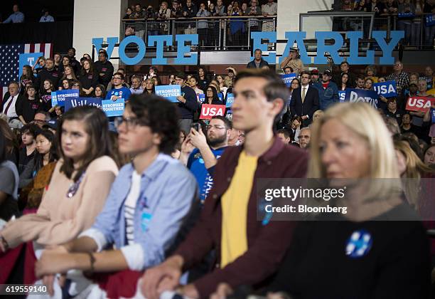 Attendees listen to Hillary Clinton, 2016 Democratic presidential nominee, not pictured, speak during a campaign event in Cleveland, Ohio, U.S., on...