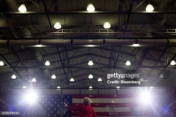 Hillary Clinton, 2016 Democratic presidential nominee, gestures towards attendees during a campaign event in Cleveland, Ohio, U.S., on Monday, Oct....