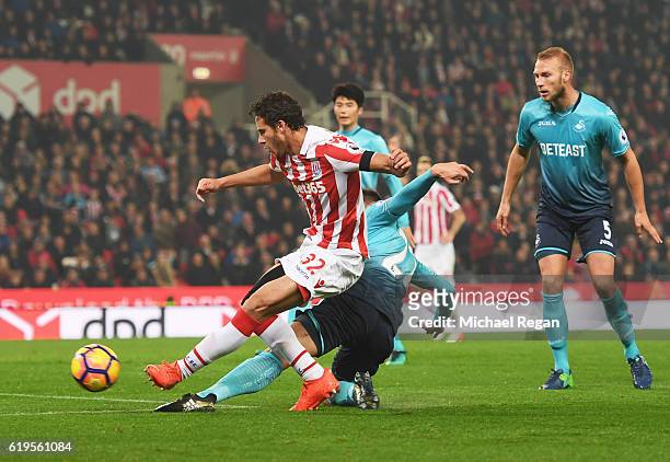 Ramadan Sobhi of Stoke City shoots at goal which leads to an own goal by Alfie Mawson of Swansea City for their second goal during the Premier League...