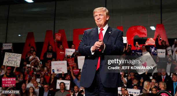 Republican Presidential nominee Donald Trump addresses supporters at Macomb Community College on October 31, 2016 in Warren, Michigan. Donald Trump...