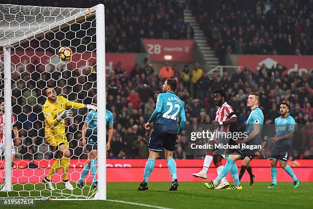 Wifried Bony of Stoke City scores their third goal past goalkeeper Lukasz Fabianski of Swansea City during the Premier League match between Stoke...