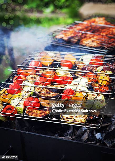 close up of grilled vegetables on grate and shashliks on fire - grilled vegetables stock pictures, royalty-free photos & images