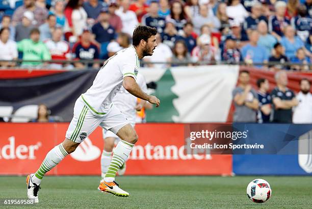 Seattle Sounders FC defender Brad Evans looks to push the ball forward. The New England Revolution defeated the Seattle Sounders FC 2-1 in a regular...