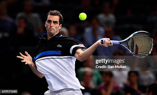 Albert Ramos-Vinolas of Spain plays a forehand against Stephane Robert of France during the Mens Singles first round match on day one of the BNP...