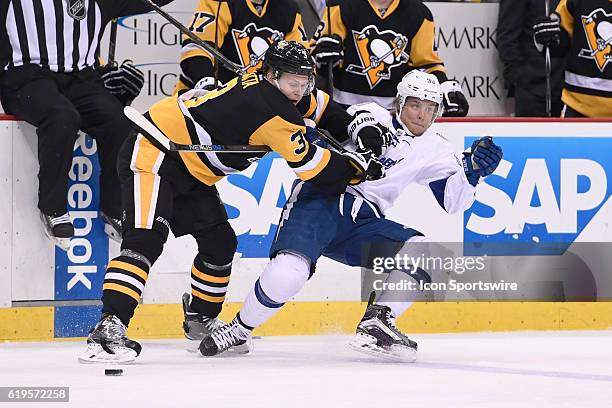 Pittsburgh Penguins defenseman Olli Maatta knocks Tampa Bay Lightning center Vladislav Namestnikov off the puck during the third period. The...