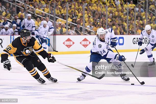 Tampa Bay Lightning right wing Ryan Callahan plays the puck around Pittsburgh Penguins defenseman Ben Lovejoy during the third period. The Pittsburgh...