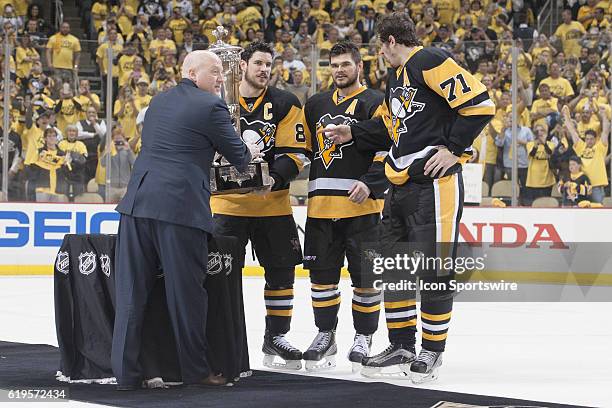 National Hockey League Deputy Commissioner Bill Daly presents the Prince of Wales Trophy to Pittsburgh Penguins center Sidney Crosby . The Pittsburgh...
