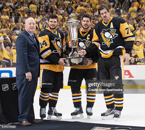 Pittsburgh Penguins center Sidney Crosby , left wing Chris Kunitz and Pittsburgh Penguins center Evgeni Malkin hold the Prince of Wales Trophy. The...