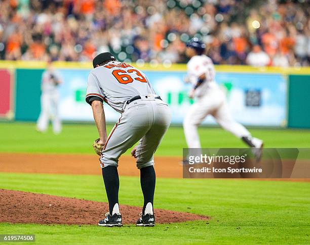 Baltimore Orioles starting pitcher Tyler Wilson reacting after given up a home-run to Houston Astros' Luis Valbuena in the sixth inning of a MLB...