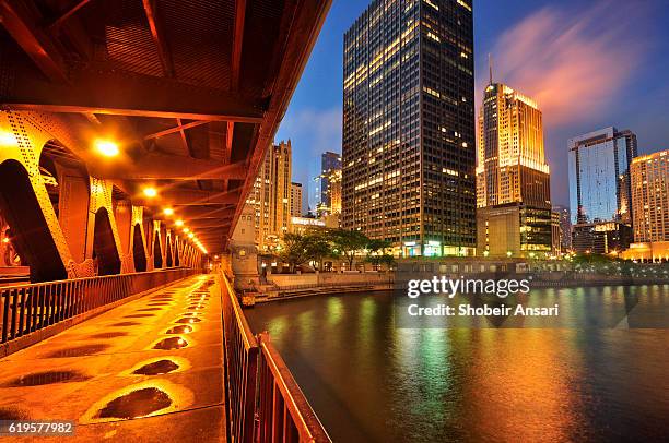 downtown chicago viewed from under michigan avenue bridge - chicago illinois landscape stock pictures, royalty-free photos & images