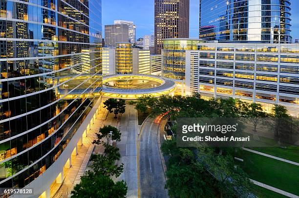houston financial district at night - houston texas stock-fotos und bilder
