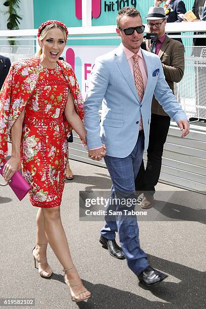 Bec and Lleyton Hewitt arrive at Melbourne Cup Day at Flemington Racecourse on November 1, 2016 in Melbourne, Australia.