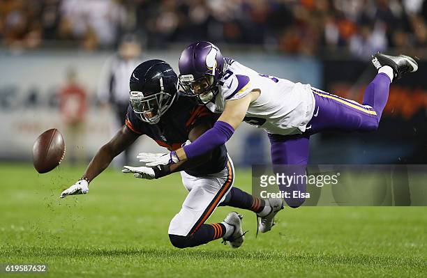 De'Vante Bausby of the Chicago Bears breaks up a pass intended for Adam Thielen of the Minnesota Vikings during the first half of their game at...
